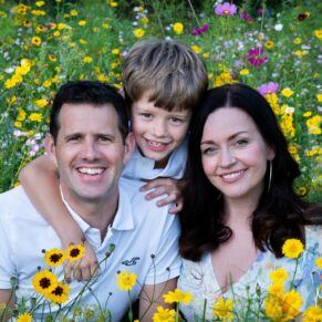 Informal family portrait photography in a colourful summer Buckinghamshire wild flower meadow