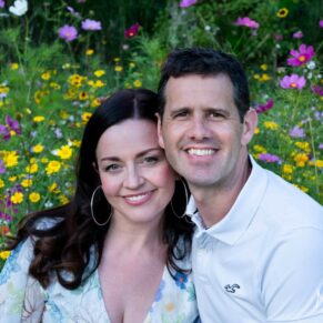 Relaxed couple portraits photography in a colourful Buckinghamshire wild flower meadow