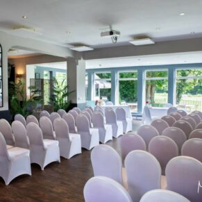 Photography of the room setup for a civil wedding ceremony at Badgemore Park in Henley on Thames