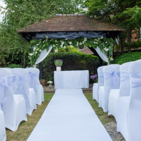 Photography of the outdoor civil wedding ceremony setup in the pretty gardens at Fredrick's Hotel in Maidenhead