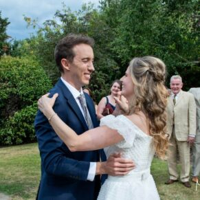 Photography of the bride and groom doing their first dance in the gardens at their Fredrick's Hotel wedding in Berkshire