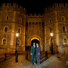This Macdonald Windsor Hotel wedding couple take a stroll to the castle entrance after dark for an atmospheric pose under the archway