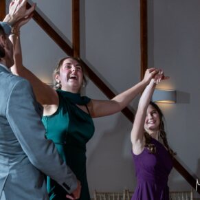It's energetic wedding dance time at Winters Tale Country Barn for these two ladies in this funky photography capture