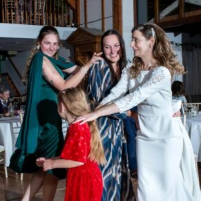 Winters Tale Country Barn wedding photography of the fun loving bride and her guests enjoying the party vibes on the dancefloor in the energetic conga line