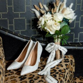 Bride's bouquet and shoe photography at this Crazy Bear Hotel winter wedding in Stadhampton